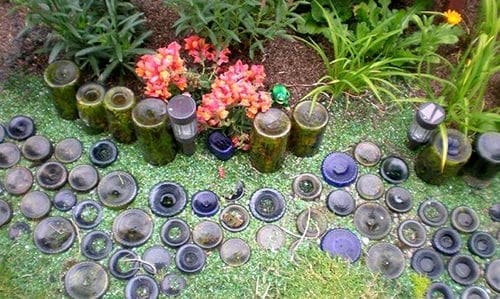 Why You Should Bury Glass Bottles In Your Garden