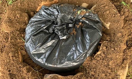 why you should bury a trash can in your backyard