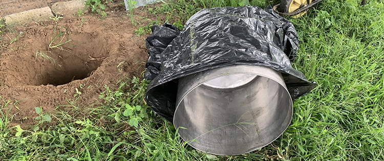 Why You Should Bury A Trash Can In Your Backyard