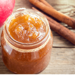 apple butter in a jar on a table